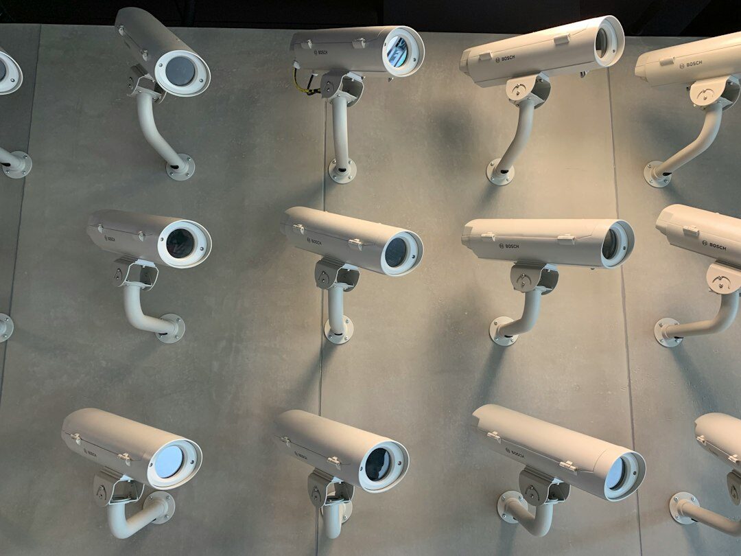Row of analogue broadcast television cameras in an empty studio
